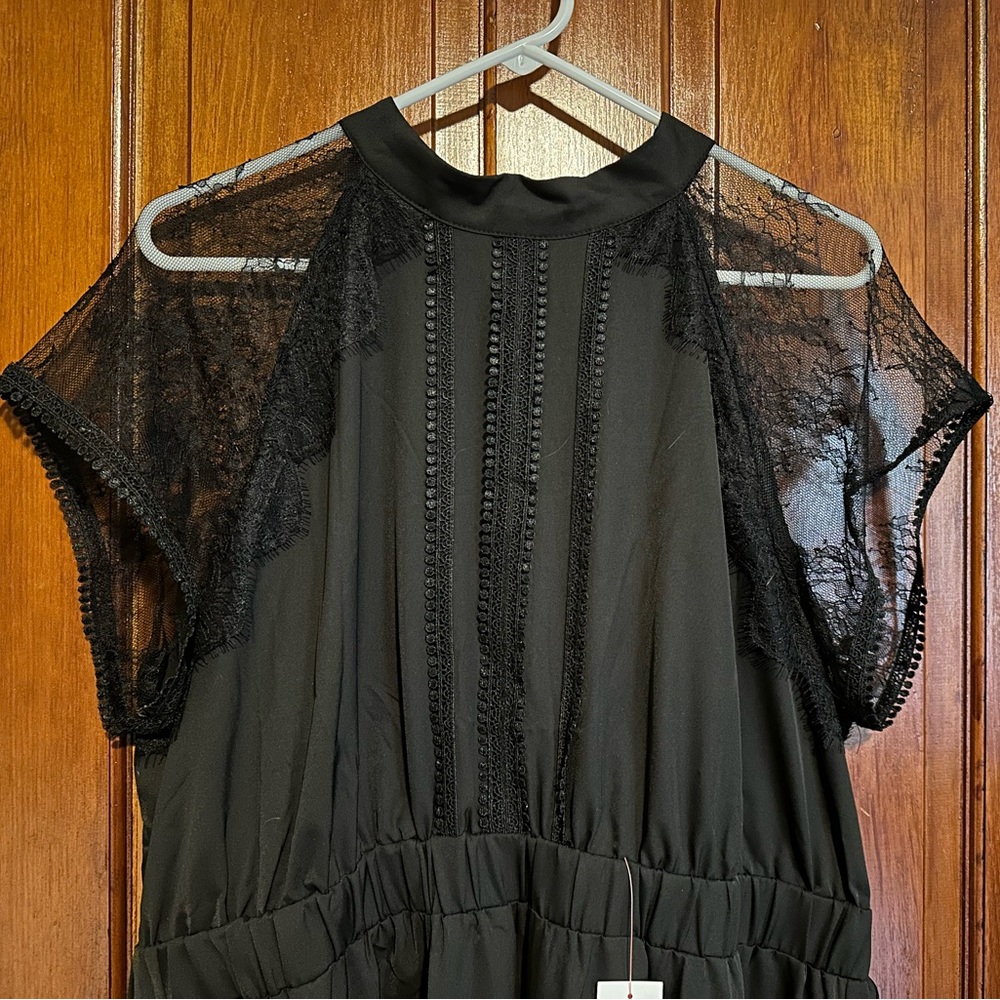 MIDI length black special occasion dress. Halter/high neck w lace cap sleeves.